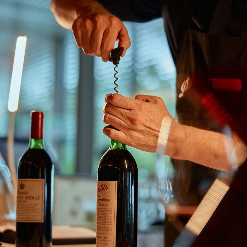 A bottle of Grange being opened at Penfolds Melbourne Re-corking Clinic