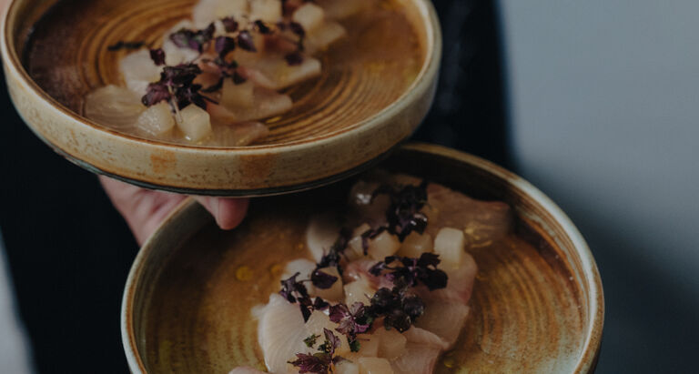 Fish being served on a dish Fish being served on a dish